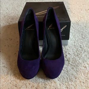 Purple suede pumps